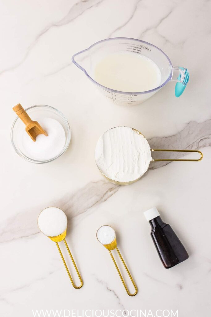 Ingredients for Vegan Waffles on a white marble kitchen counter